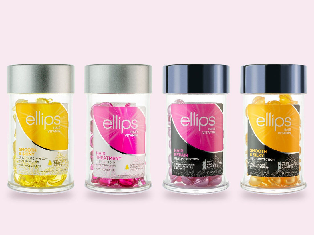 Four Ellips Hair Vitamin jars in a row: Smooth & Shiny with yellow capsules, Hair Treatment with pink capsules, Hair Repair with pearly pink capsules and Smooth & Silky with amber capsules.